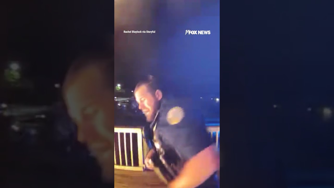 SEE IT: Hero cop kicks down door of burning building to rescue a family #shorts