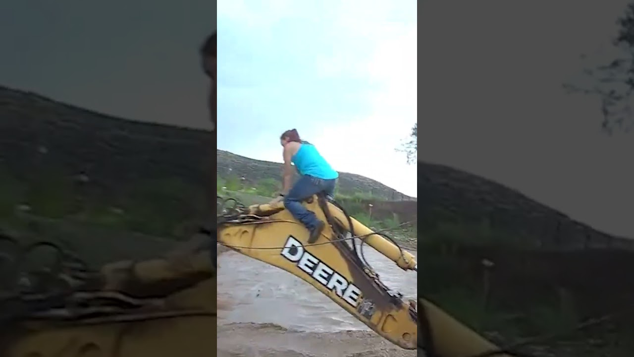 A family is trapped in a flash flood & rescuers reach them moments before their truck is swept away