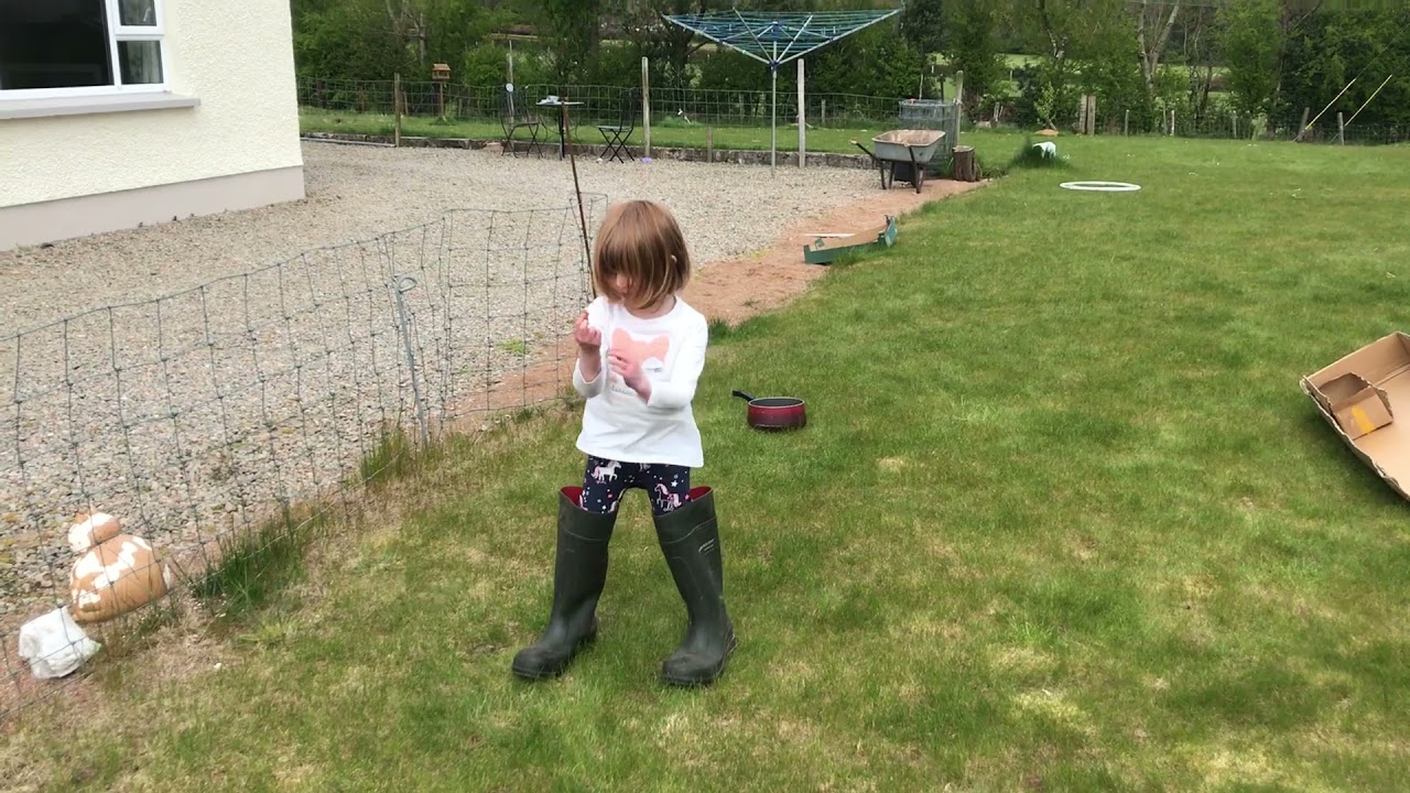 Wee farm girl in big wellies