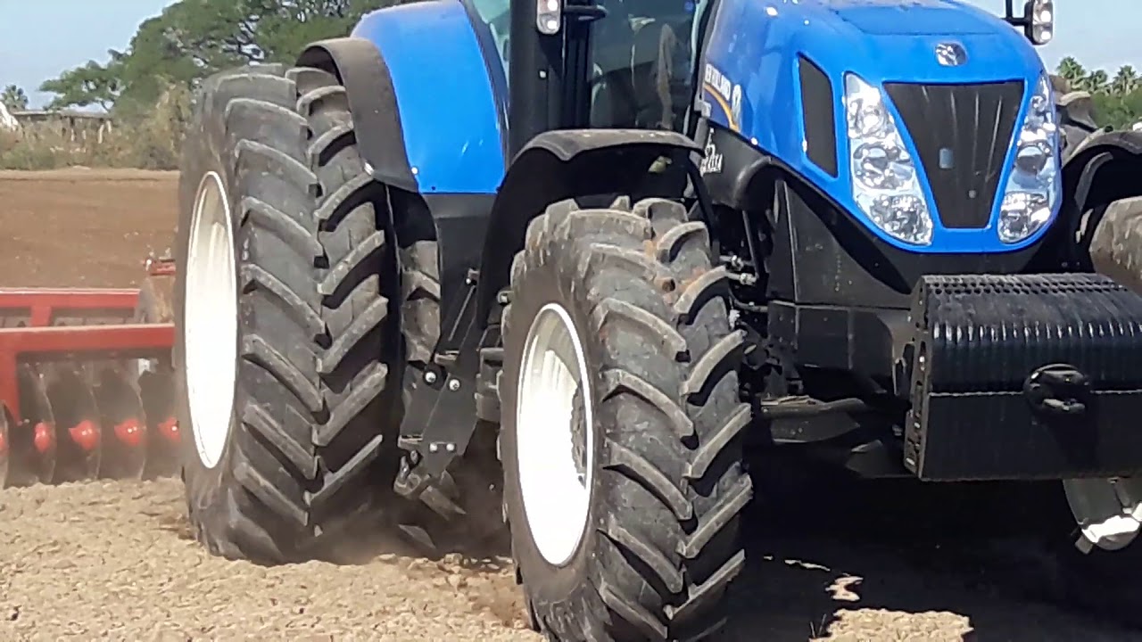 T7060  NEW HOLLAND  210 HP  &  RASTRA DE 44 DISCOS  PESADA  INTERNATIONAL  4.5 HAS/ HORA