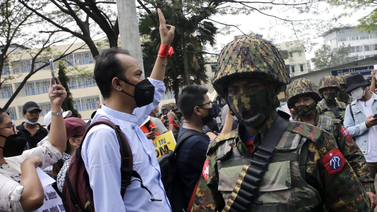 Myanmar: Protesters cheer as police stopped from raiding Aung San Suu Kyi's party HQ