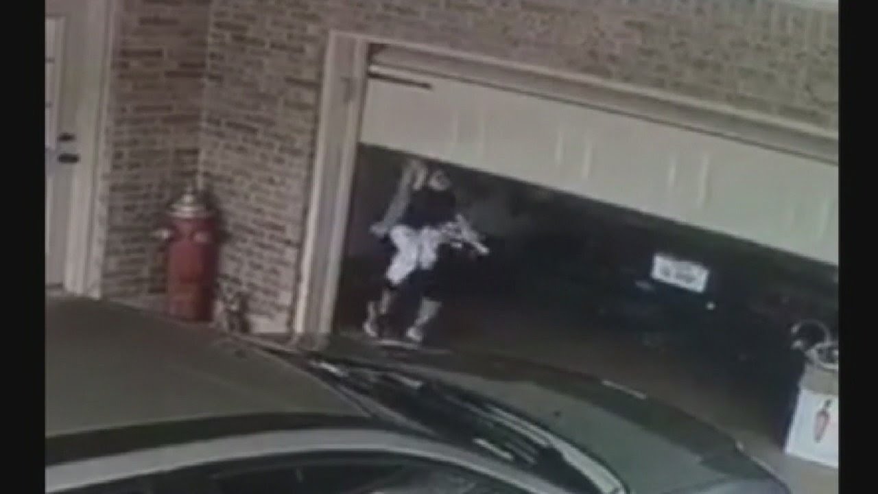 Toddler suspended in air when bracelet gets caught in garage door