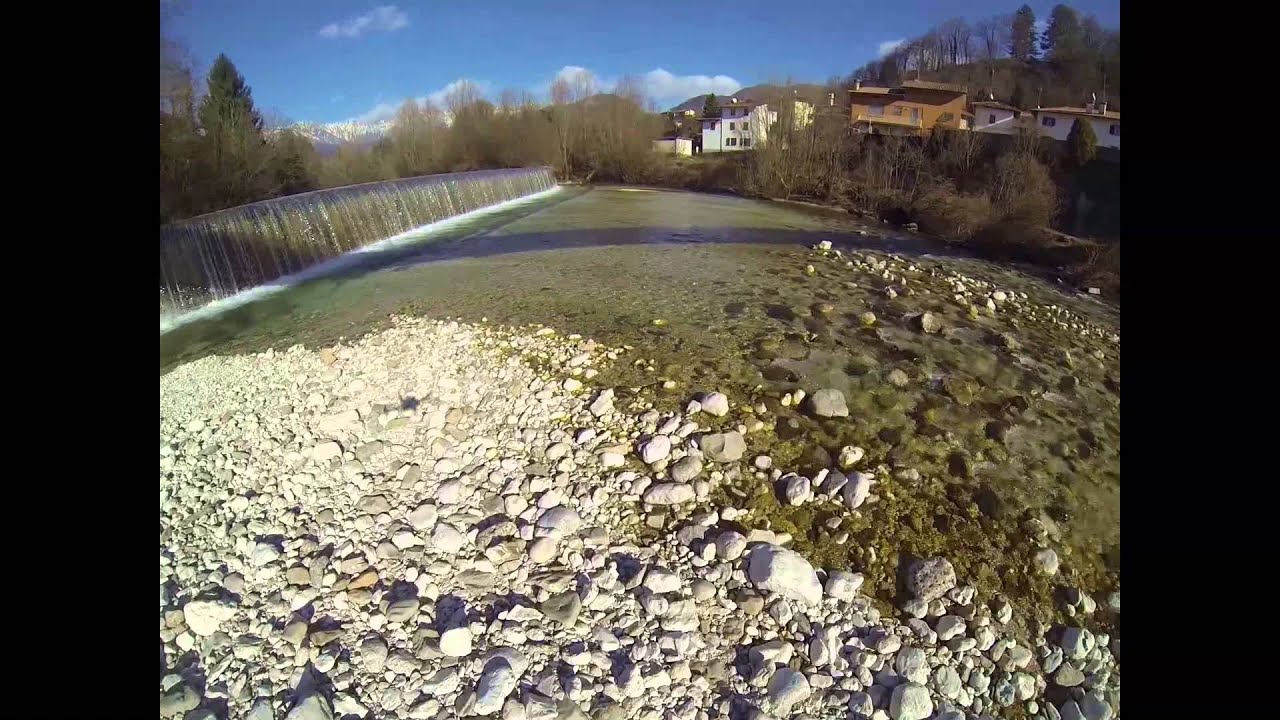 Flying over Tarcento and over the river Torre
