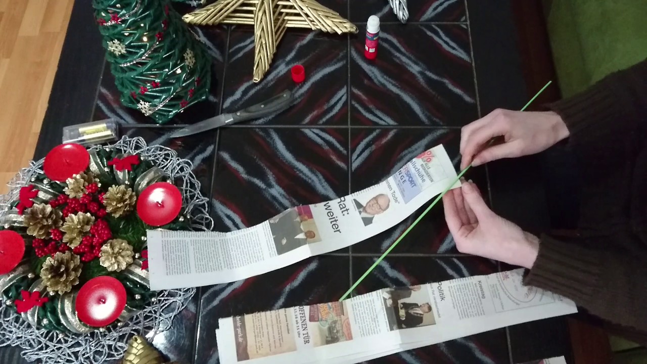 Röllchen aus Zeitung herstellen