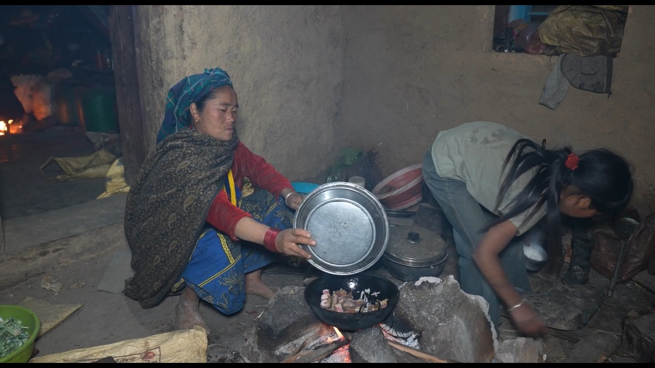 Eating vegetable curry with green leafy vegetables and meat in the villagell Rural village life