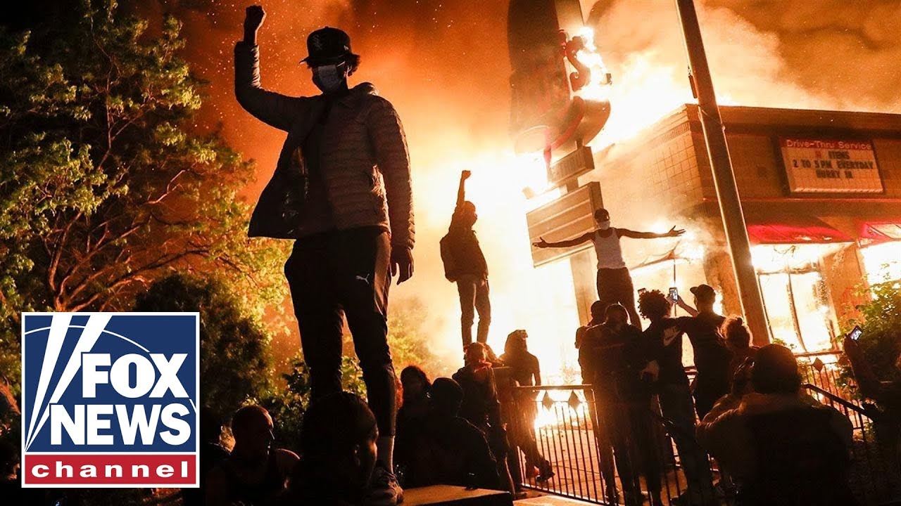 Minneapolis protesters burn down police precinct as tensions escalate