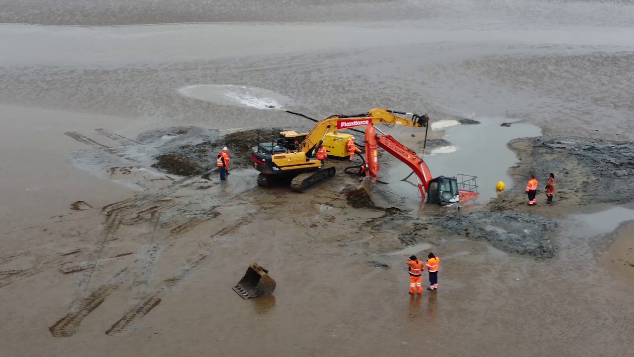 Digger Stuck in the beach weston super Mare