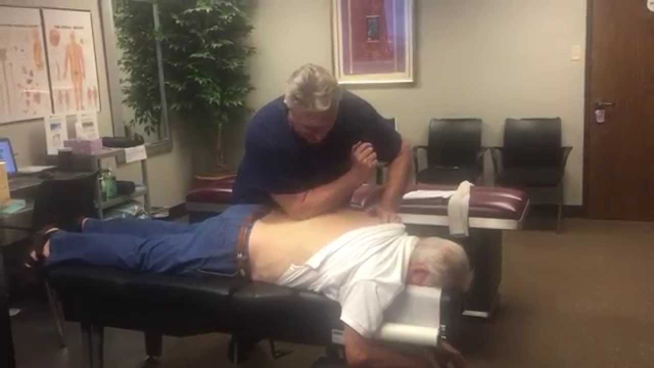 Houston Chiropractor & Palmer Graduate Dr Gregory Johnson Deep Tissue Work On Muscle Spasm