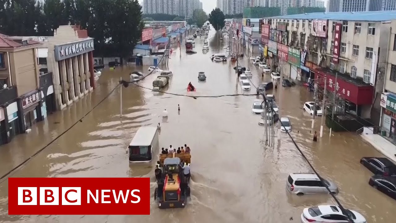 Drone video shows scale of China floods damage - BBC News