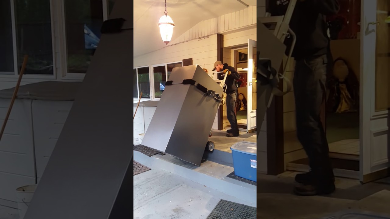 Tracker Safe moving a large gun safe with an Ultra-Lift stair stepping machine