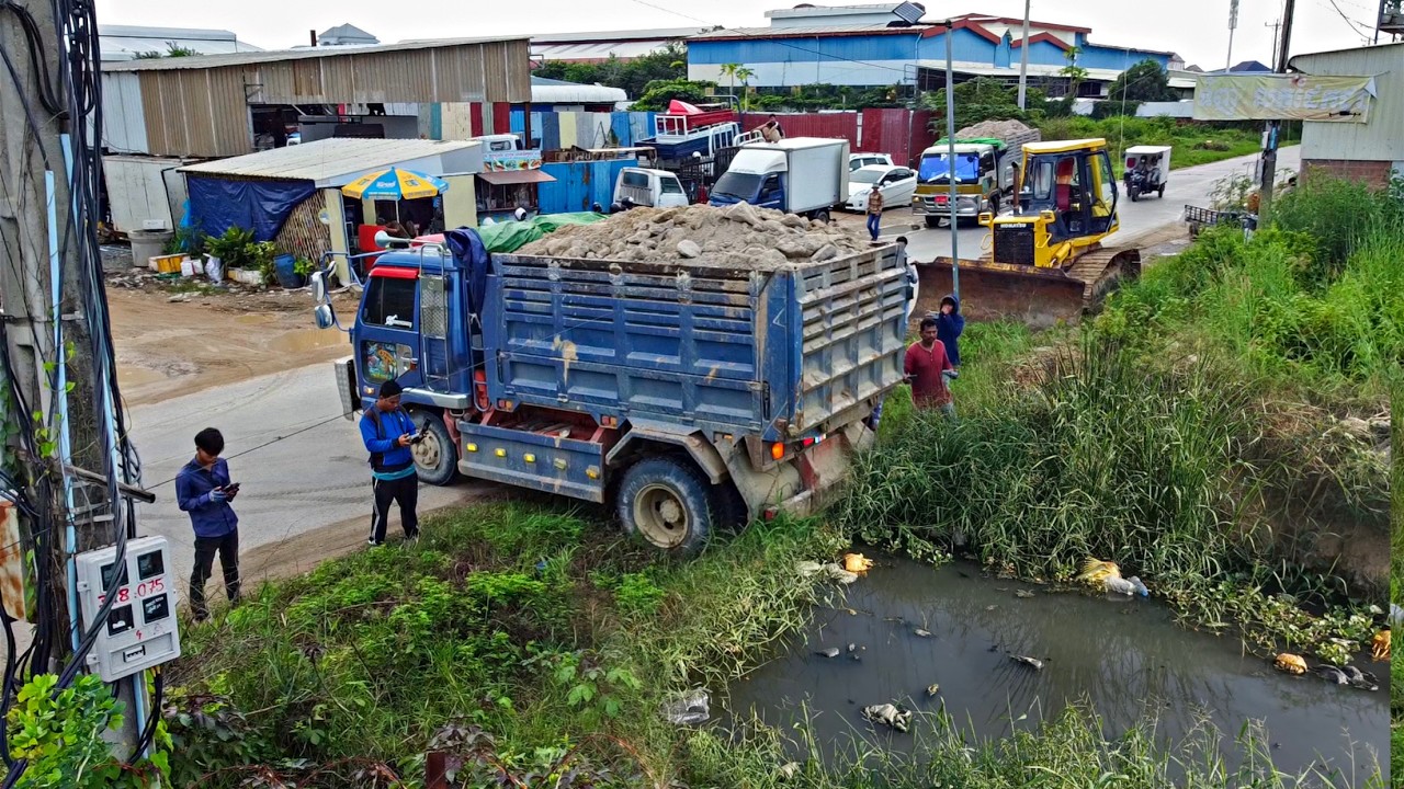 Landfill Project Making Road Remove the grass Using Bulldozer Komat'Su D61EX with 5ton Trucks