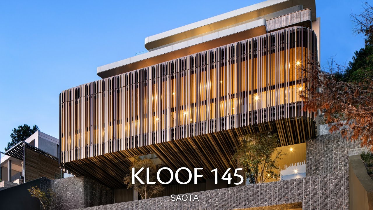 House in the Form of Staggered Blocks Rising Along the Mountainside