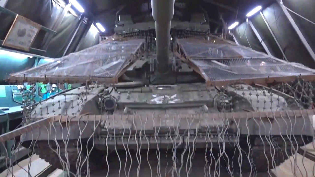 Installing drone protection on Russia's T-80B and T-72B3M tanks