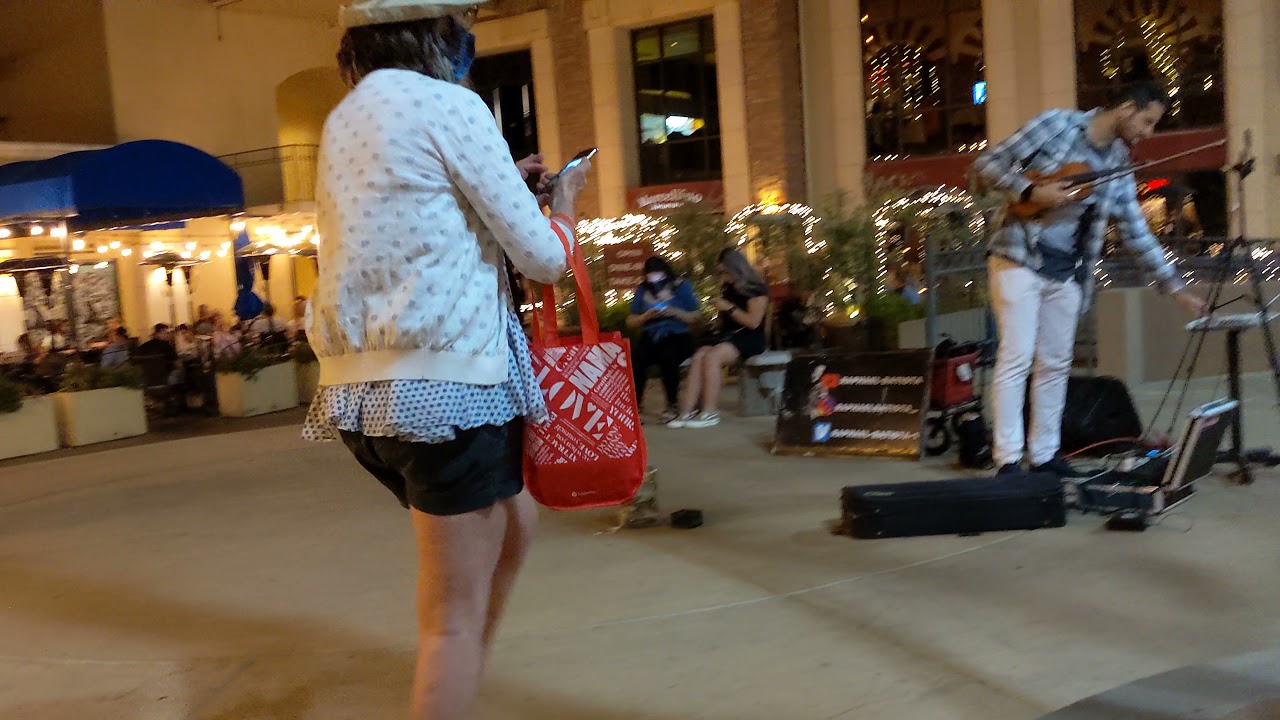Street musician at night outside Marcellino Ristorante, Scottsdale, AZ, 2021-03-20