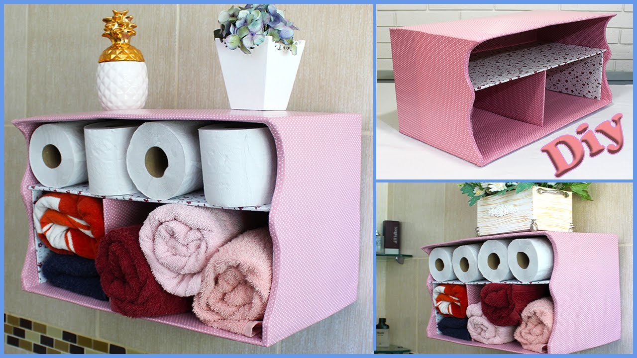Toalheiro e Porta papel, feito com caixa de papelão.