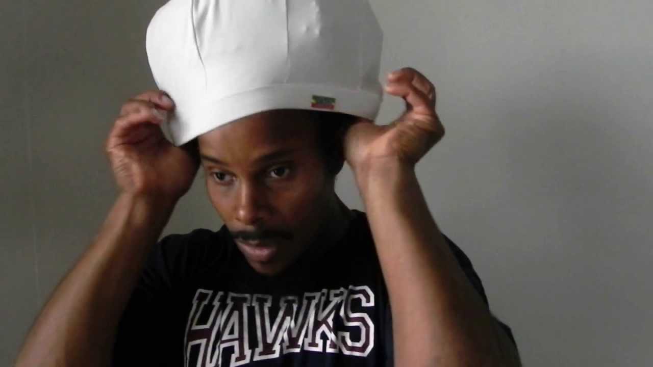 How to put on your Jah Roots Stretch Hat in 30 seconds....