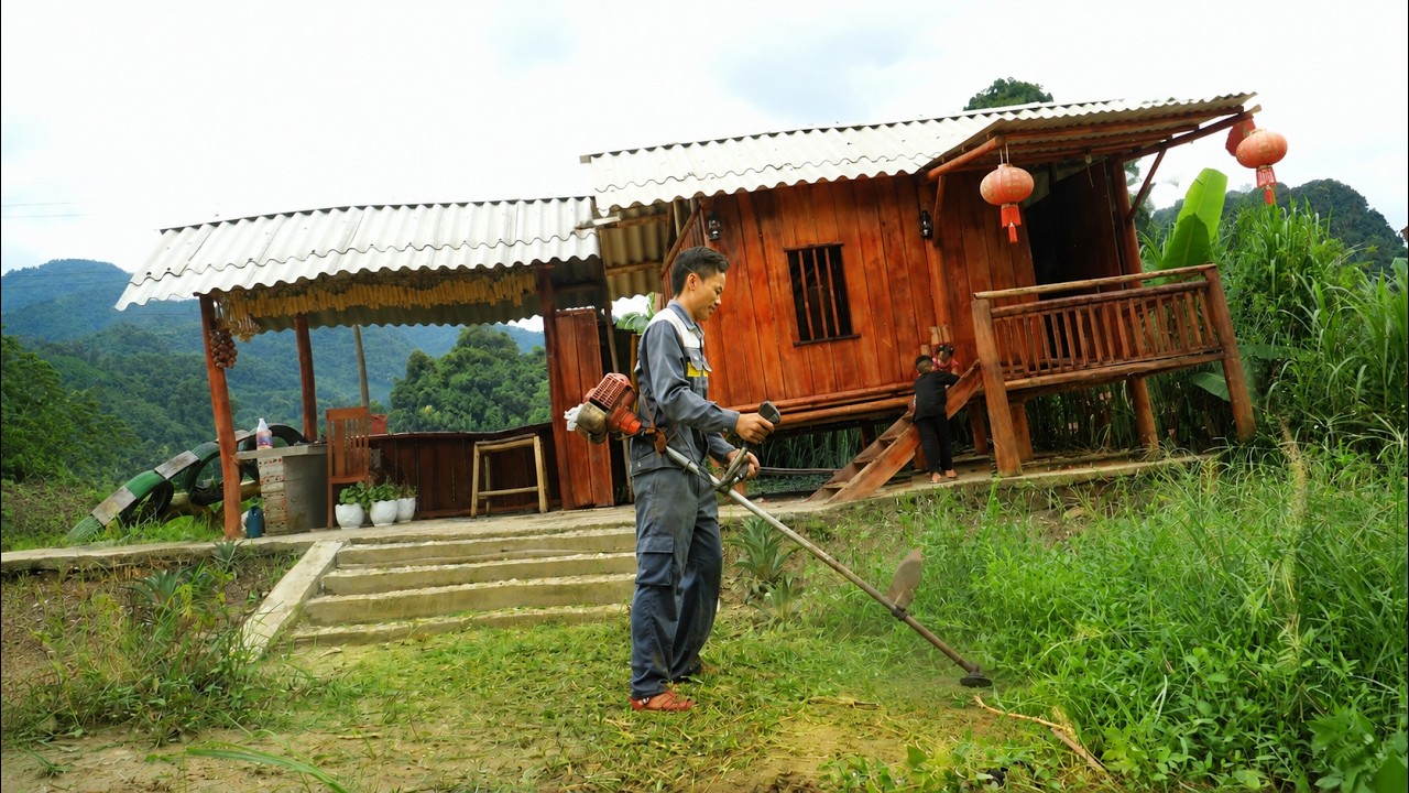 A single father left everything behind to build a wooden house by the river, a surprising feat.
