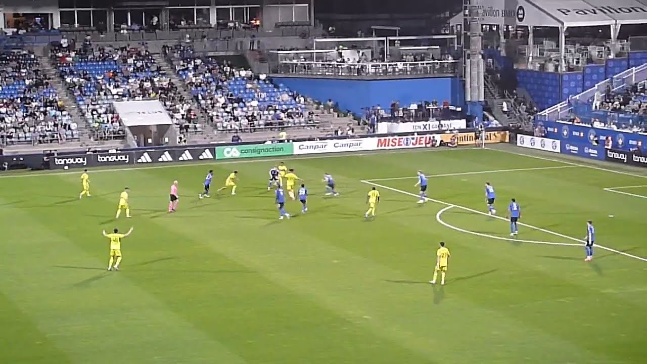 Jonathan Sirois of CF Montreal (Impact) makes a great save vs. Jacen Russell-Rowe of Columbus Crew