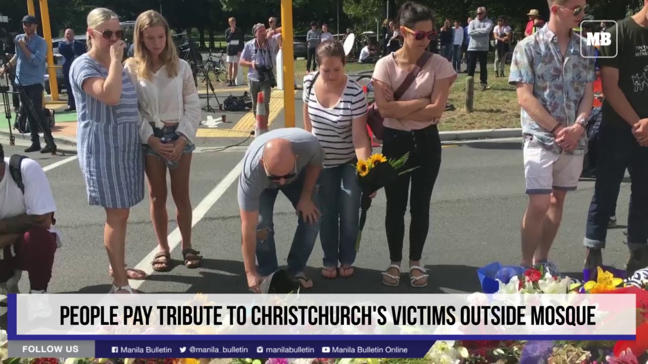 People pay tribute to Christchurch's victims outside mosque