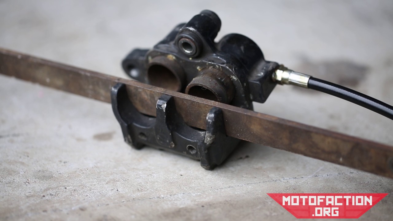 How to remove stuck brake caliper pistons with a grease gun