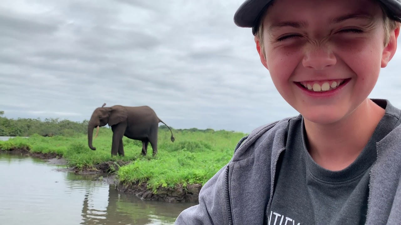 Wiener kicking and snorkeling elephant in Gabon with Hogsback Leather backpack