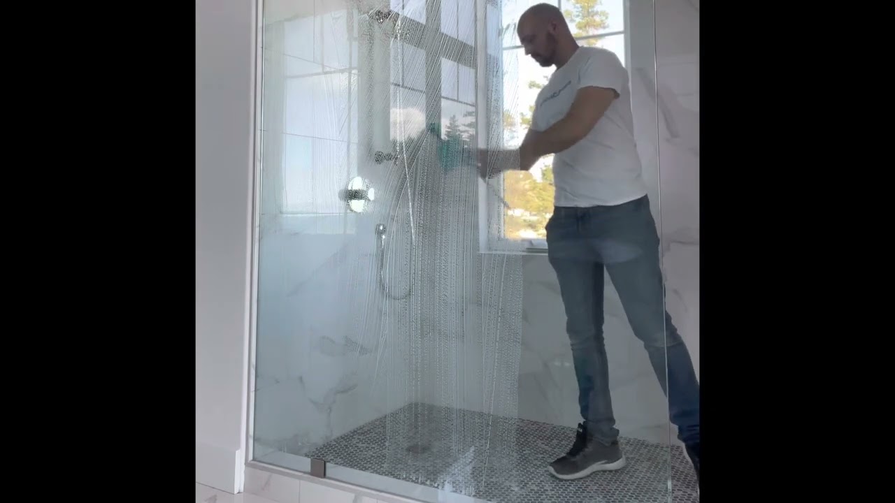 Fast way to clean construction dust off shower glass and tile