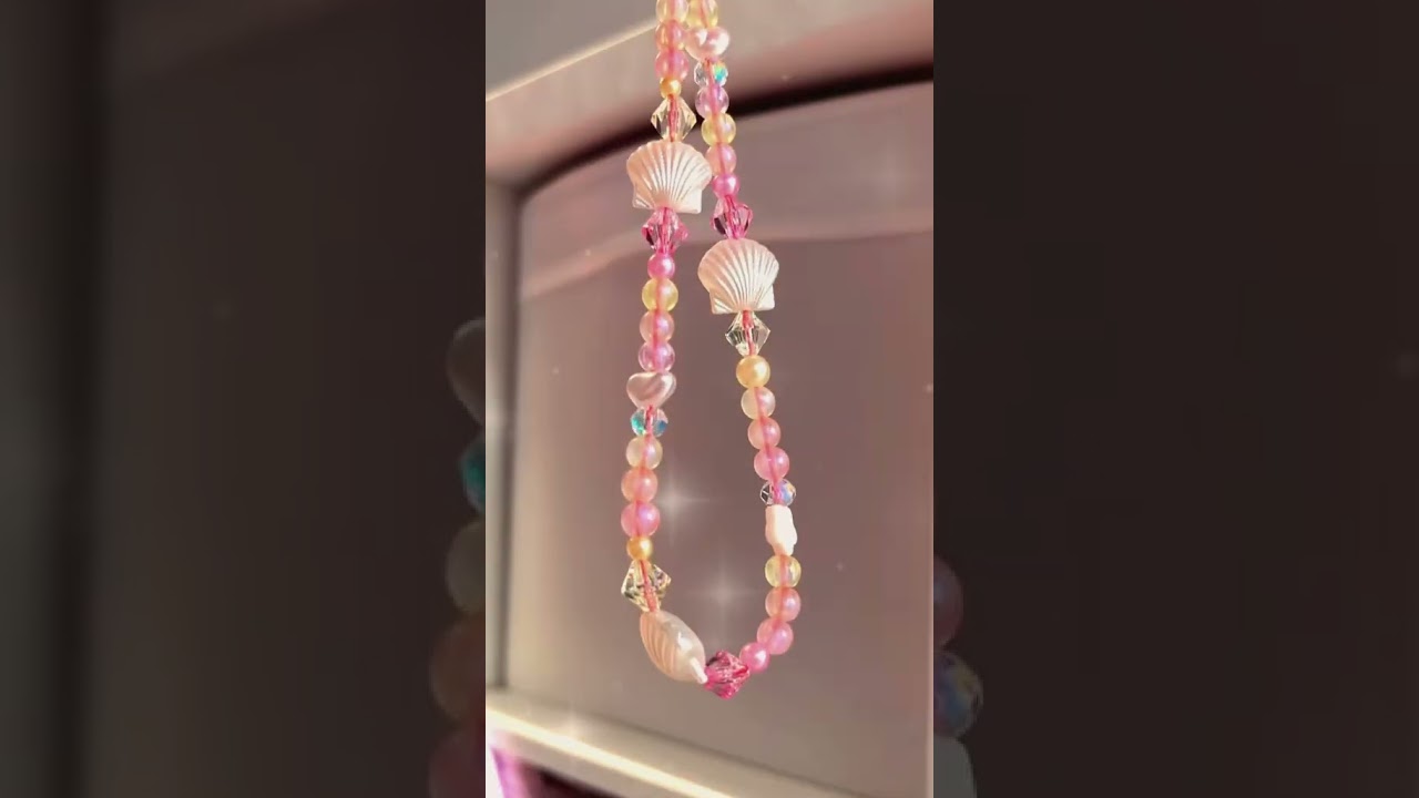 Summer themed camera charm they asked for orange, yellow, pink and shells. How did I do?