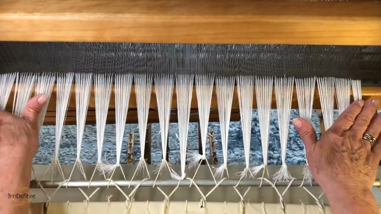 Comment attacher les fils de chaîne sur le métier
