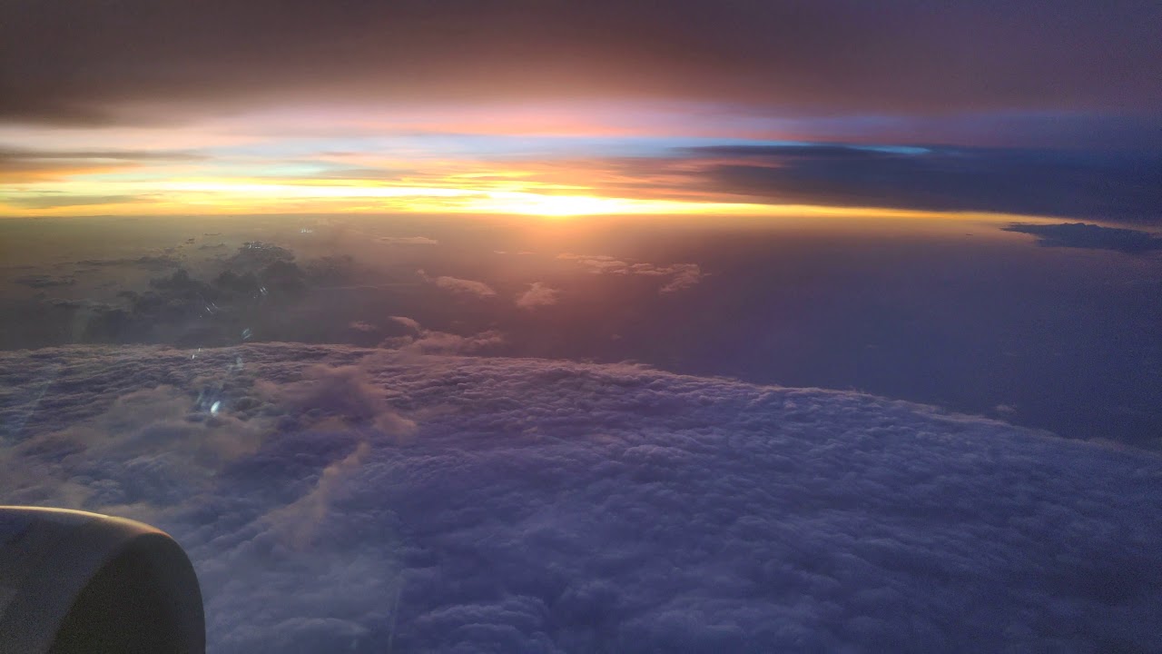 Looking Out The Airplane Window Seat | cloudy sunset |