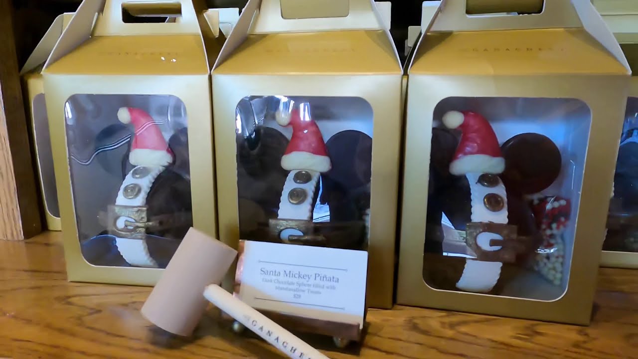 The Ganachery at Disney Springs. Olaf hot chocolate bomb. Santa Mickey piñata. Best choc in Disney.
