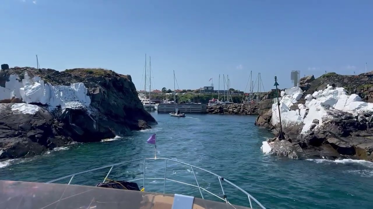 Entering Beaucette Marina with a Sealine T46 motorboat driving from the Flybridge