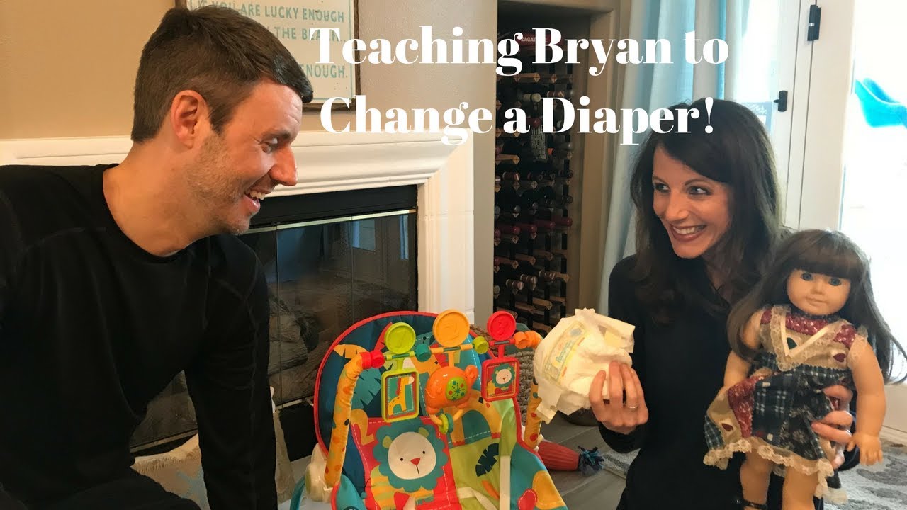 Teaching Bryan how to change a Diaper!