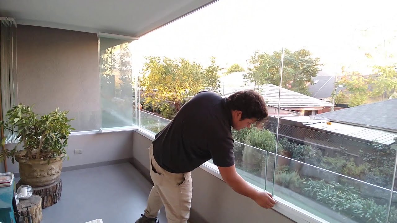 Cierre de balcones con ventanas plegables de vidrio templado