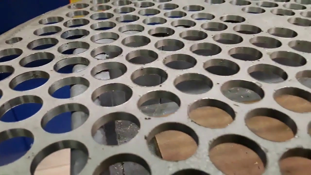 Deburring and edge radius of drilled holes on stainless steel plate using an Apex Model 2037M-DSS