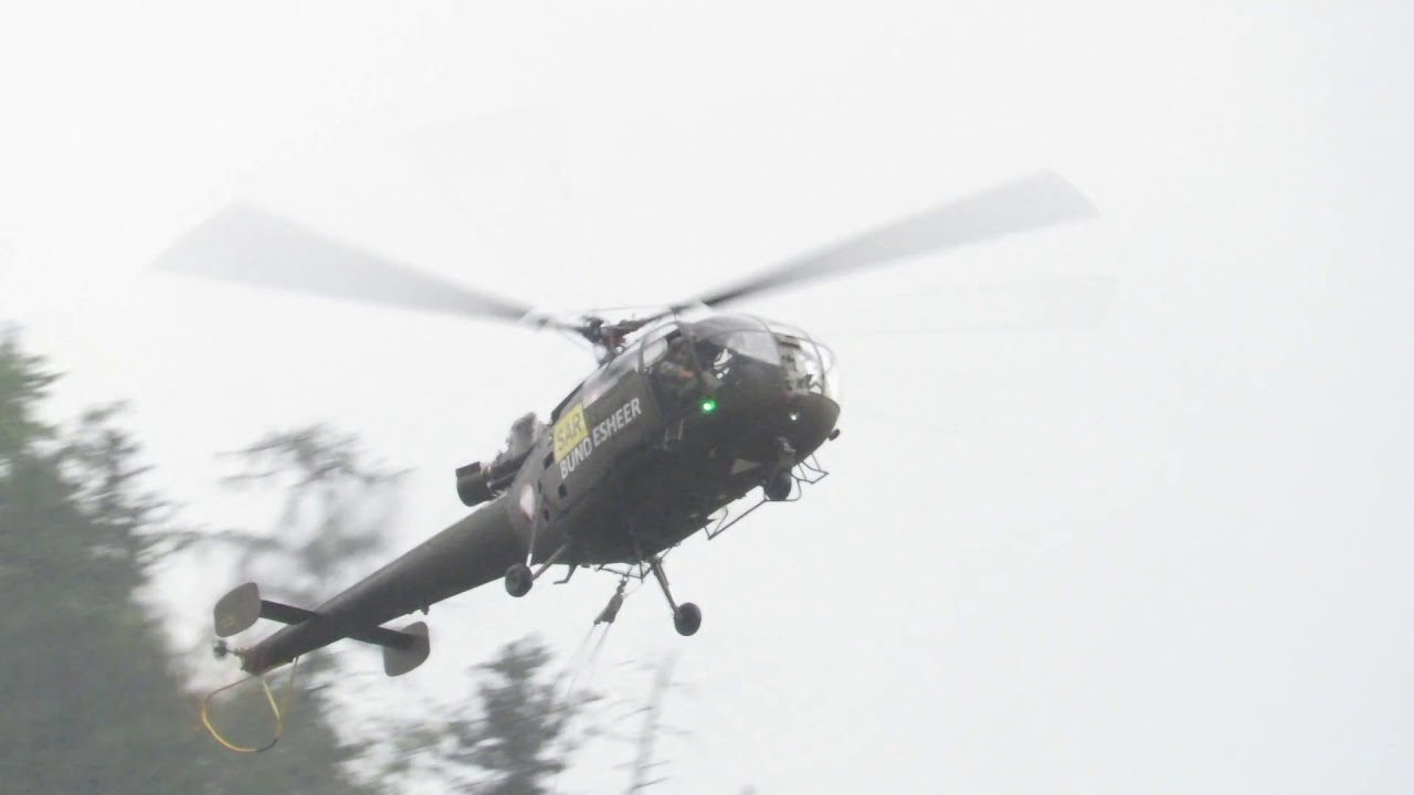 Austrian military helicopters fighting forest fire at Hallstatt