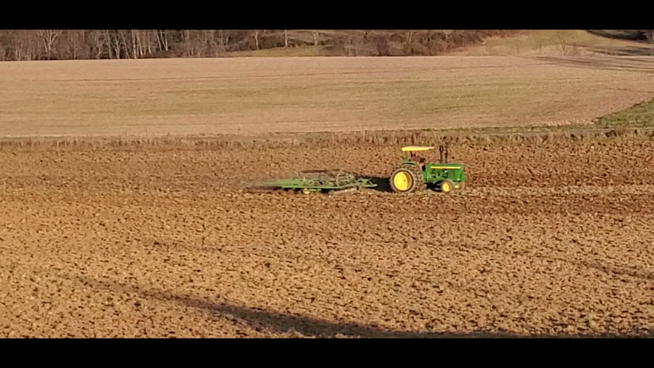 John Deere 6030 pulling 724 Soil Finisher