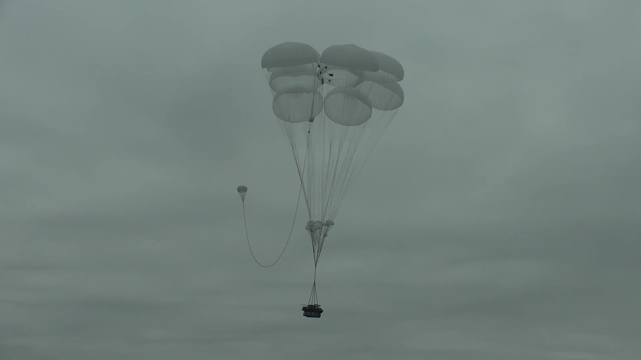 Russian Il-76s dropping light tanks BMD-2 and paratroops
