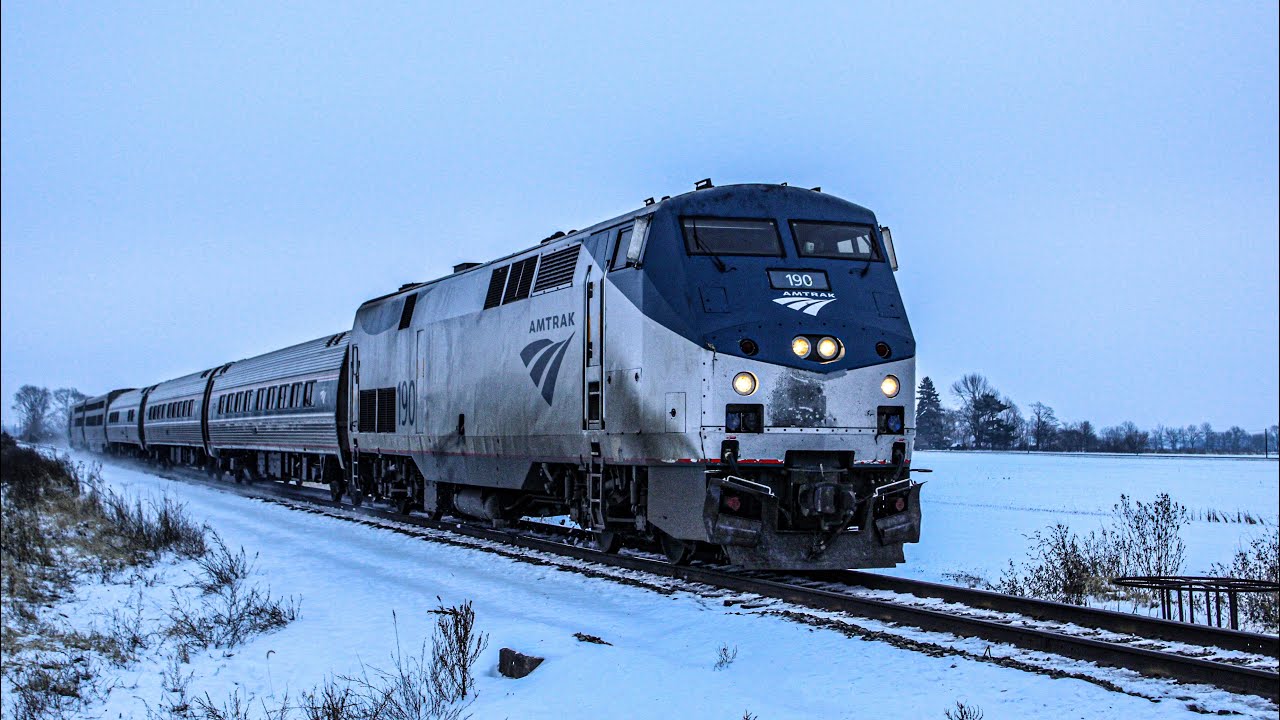 P051 w/ AMTK 190 running 5 hours late kicking up snow in Gwynneville IN
