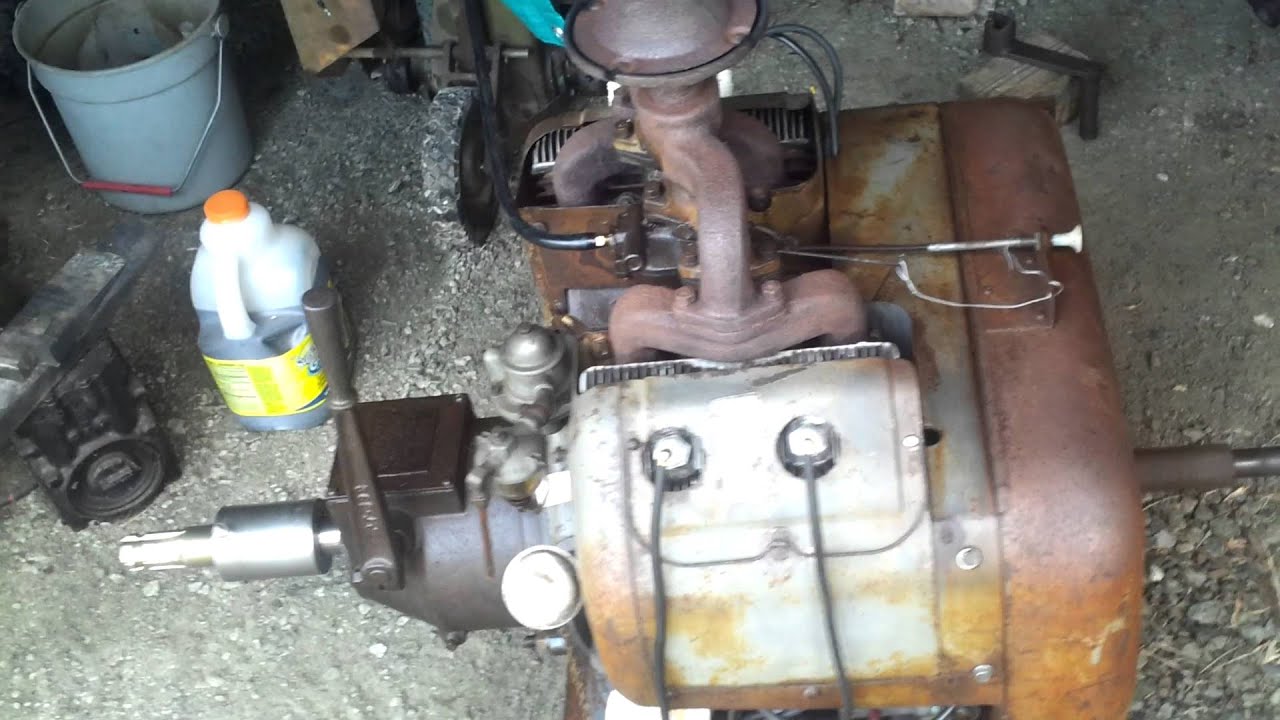 Hand crank starting a WISCONSIN VE4 engine .. easy-peezy!