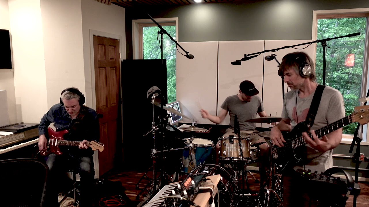 Shitty Shitty Jam Band. Avi Bortnick on Guitar, Jesse Murphy on Bass, and Aaron Johnston on drums.
