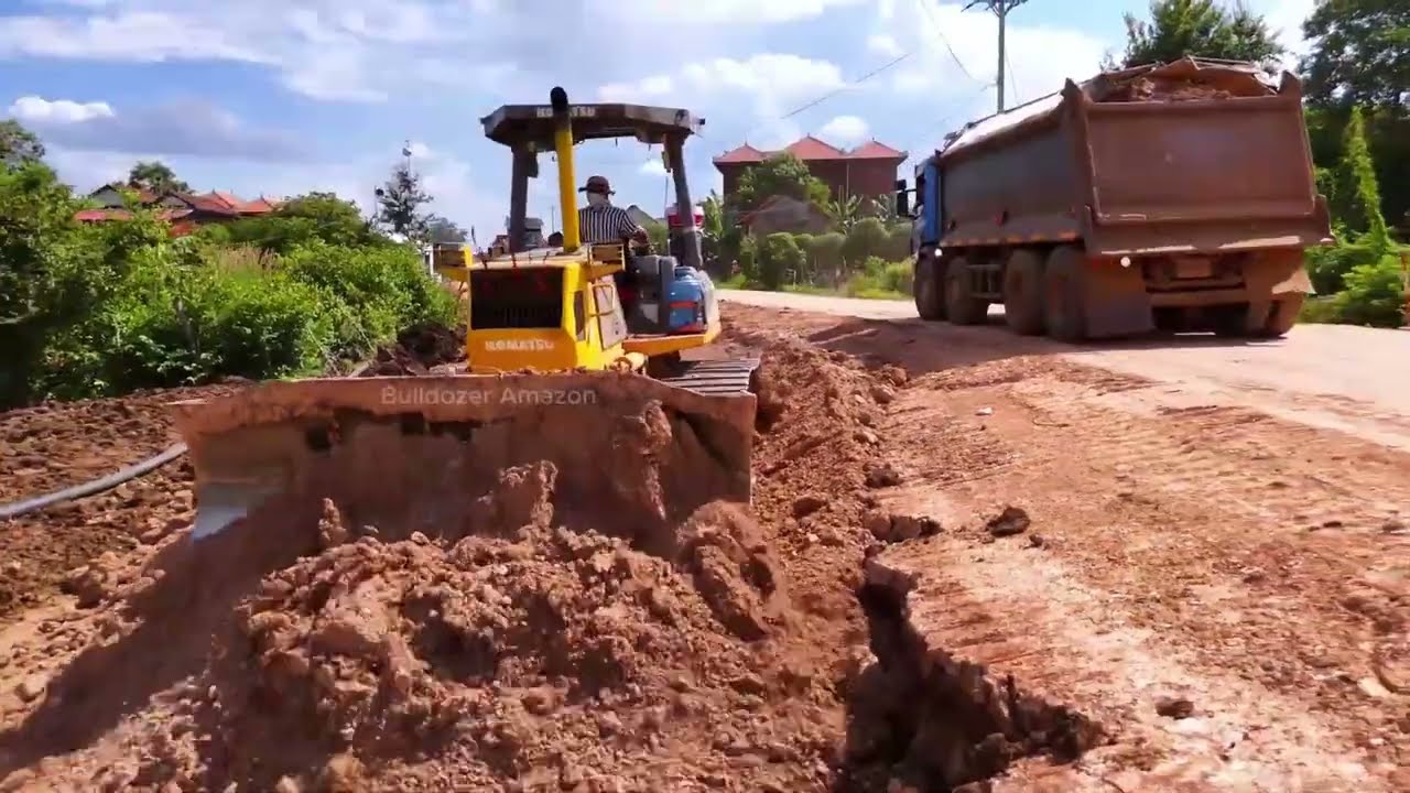 Subgrade Compaction! Expert Bulldozer Operator Spreading Rocky Soil Filling Up For Strong Road Base