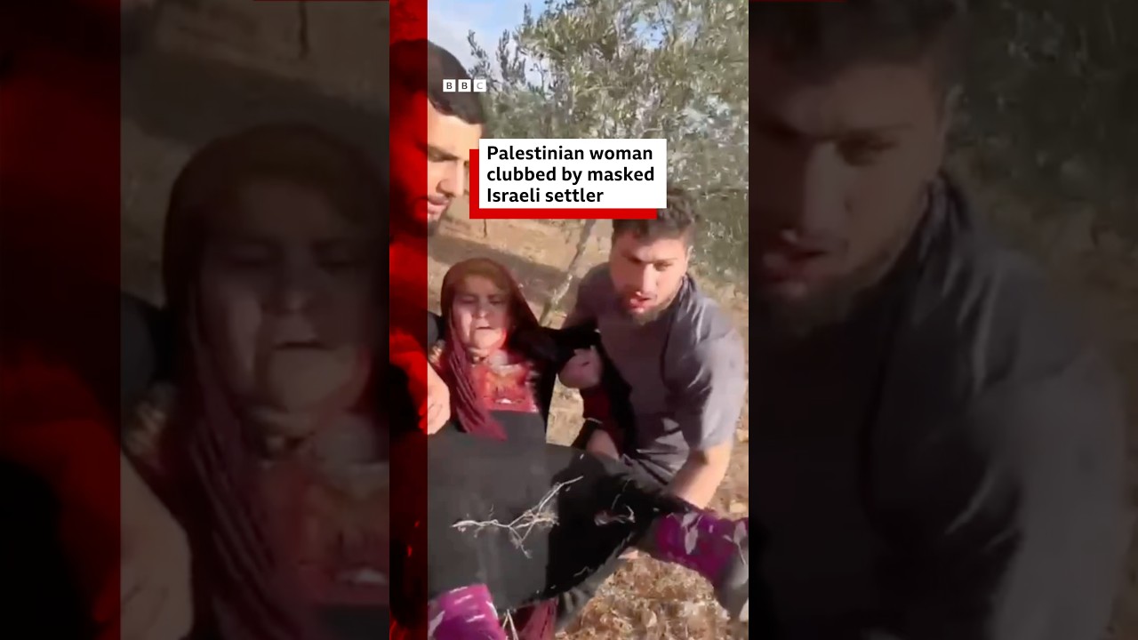 Израильский поселенец в маске избил палестинку. #BBCNews
