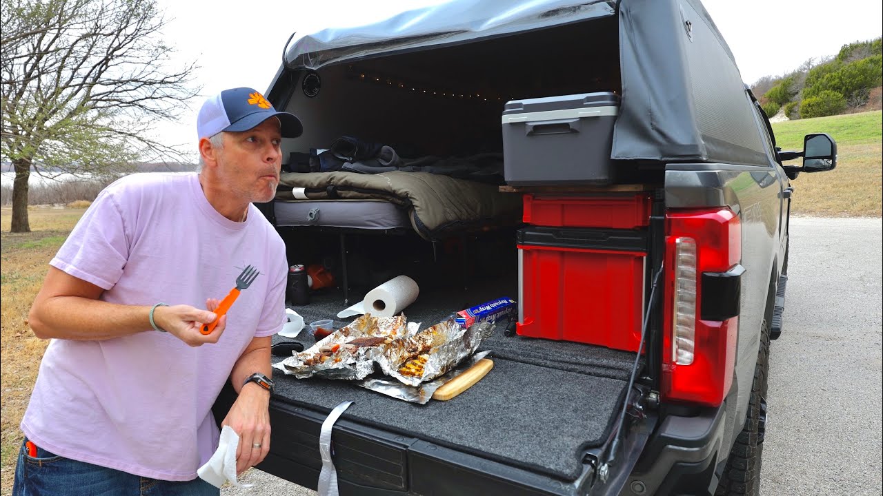 Solo truck camping in a new inflatable truck shell.  Campfire ribs and cheesy potatoes
