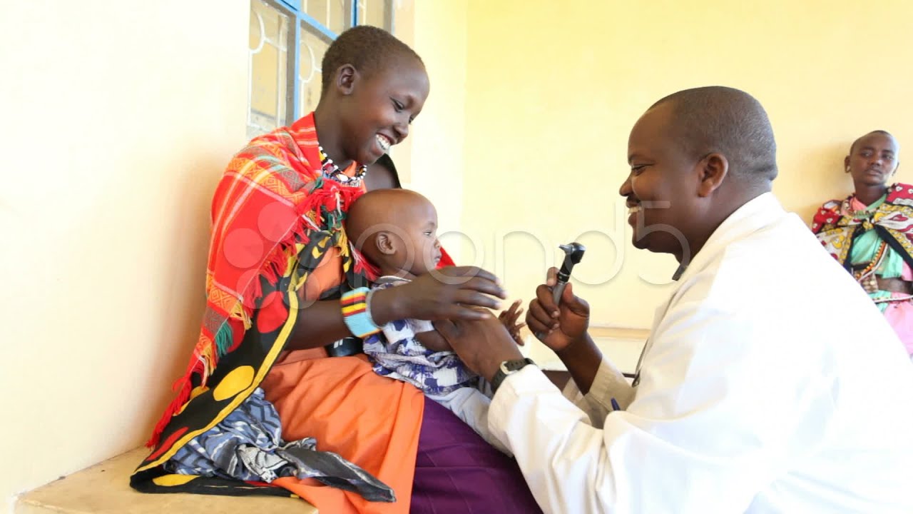 African Doctor examining child patient. Kenya, Africa. Stock Footage