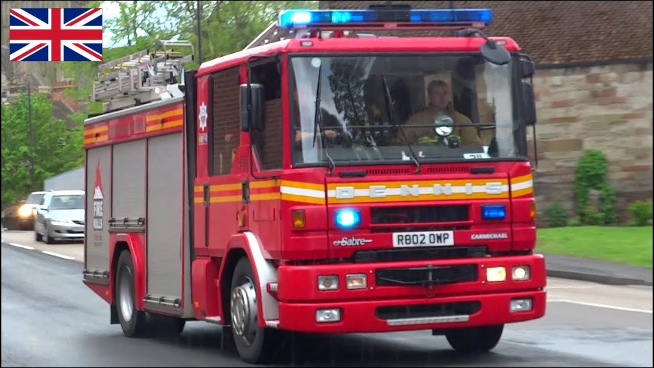 Fire engine responding with two tone horn sirens and lights + on scene