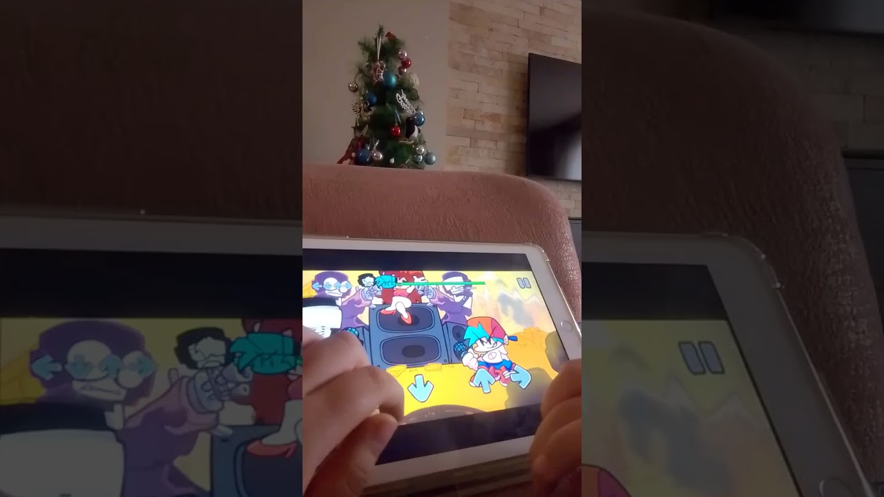 M friend Playing FNF on his iPad