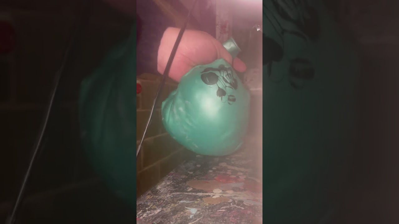 Deflating a 36&rdquo; latex balloon with a hair dryer to become back to its original state.