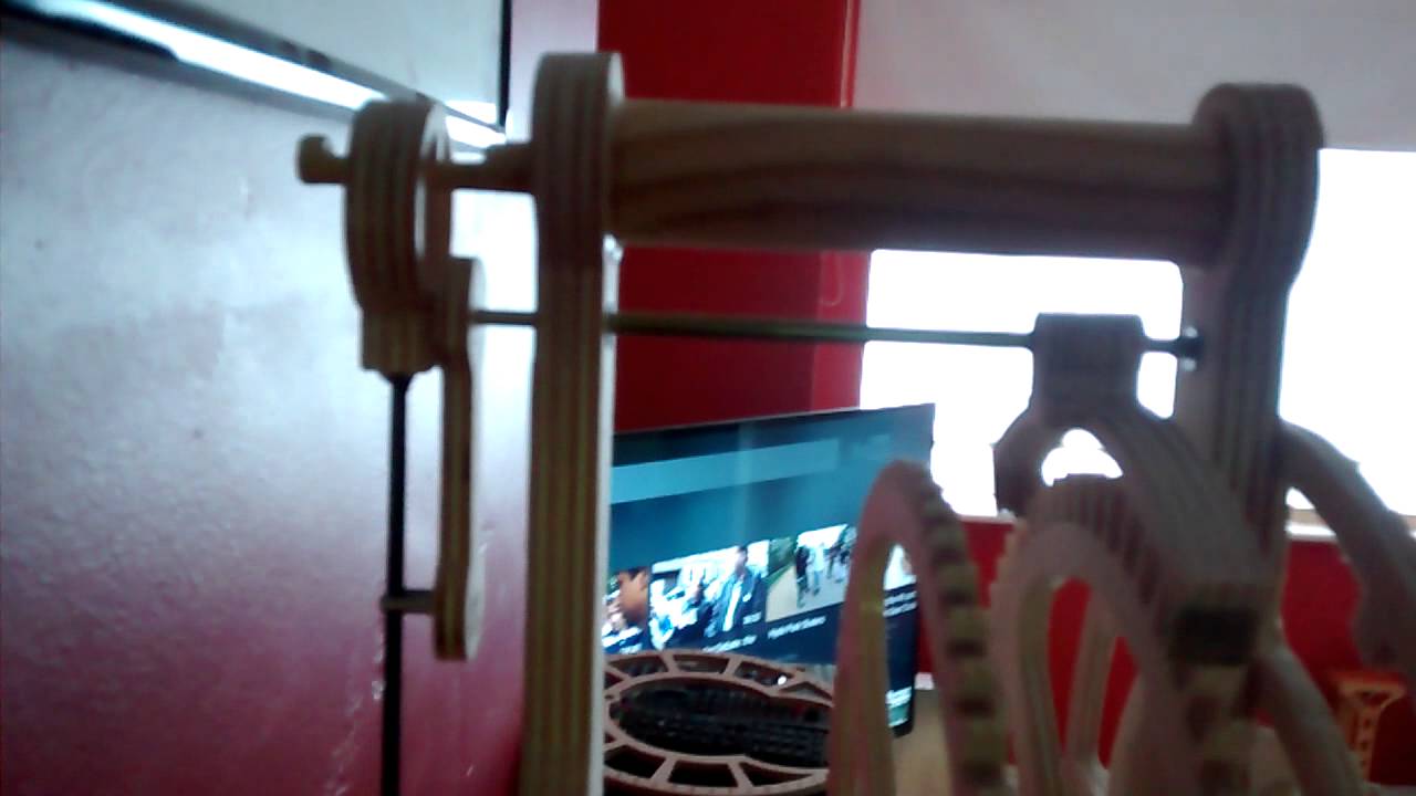 Spring powered wood gear clock.