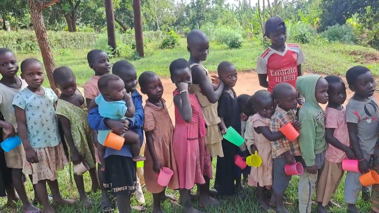 Sharing breakfast with orphans whose parents are no where to provide daily meals to them,  