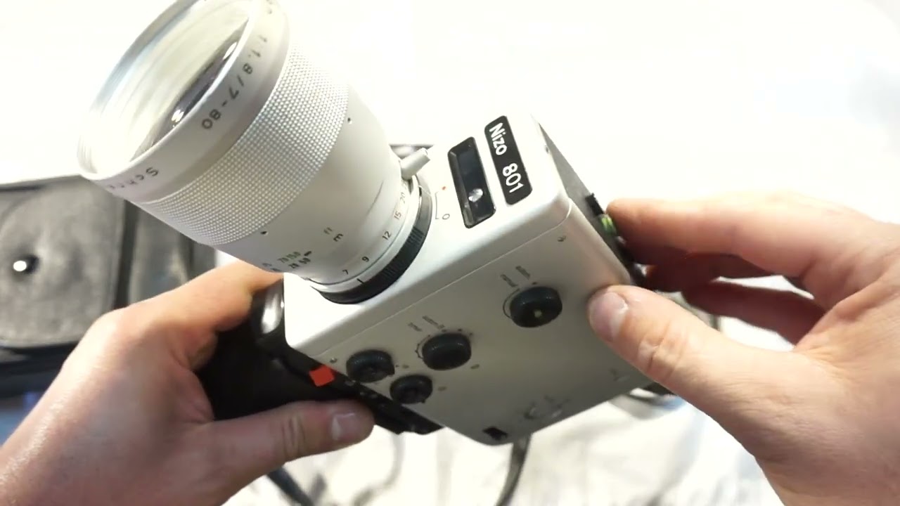 Nizo 801 loading Super 8 film and batteries on Super 8 camera Braun Nizo 801 Macro + free ship
